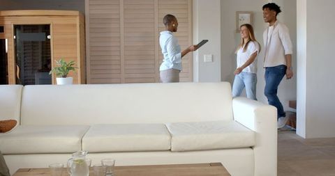 Relaxing at Home with Modern Tablet Device in Contemporary Living Room