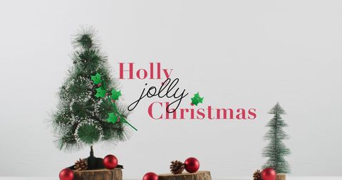 Festive Christmas Scene with Mini Fir Trees and Holly Jolly Text
