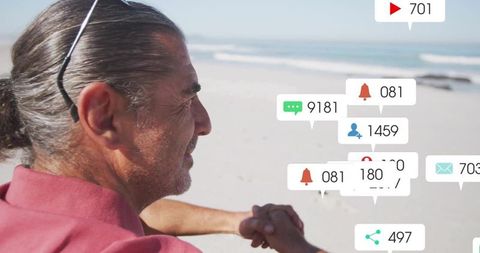 Man relaxing on beach with social media connections overlay