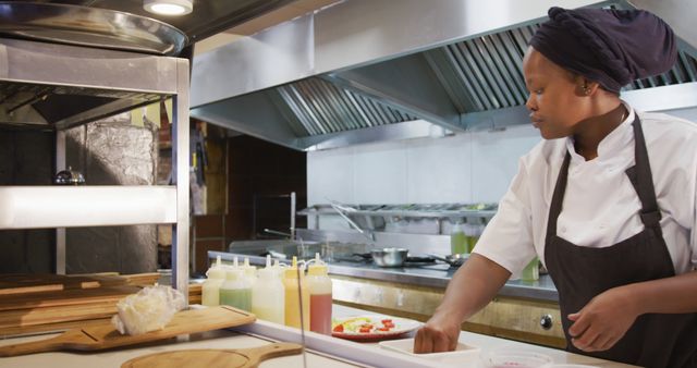 Professional Chef Preparing Dishes in Modern Commercial Kitchen - Download Free Stock Images Pikwizard.com