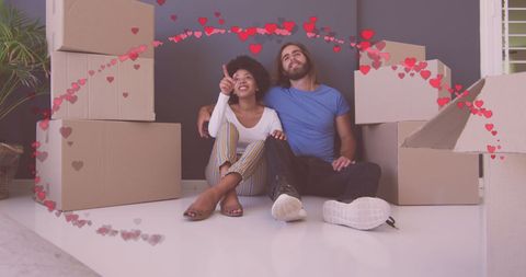 Happy Couple in New Home Surrounded by Moving Boxes and Hearts - Download Free Stock Images Pikwizard.com