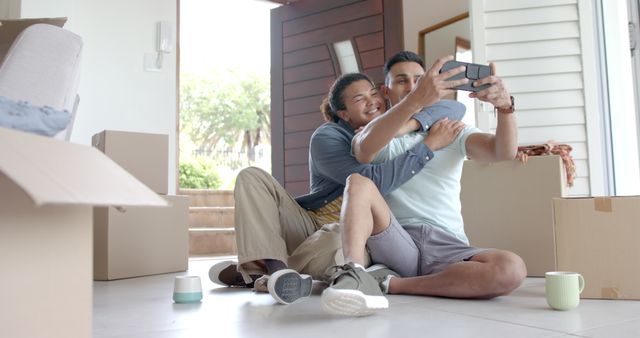 Happy Couple Taking Selfie in Their New Home with Moving Boxes - Download Free Stock Images Pikwizard.com