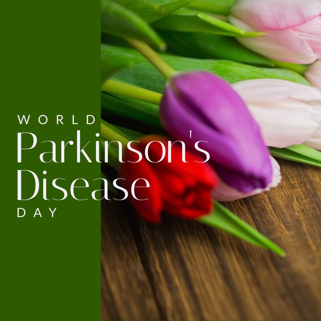 Image of world parkinson's day text over colourful flowers on wooden table. World parkinson's day and celebration concept digitally generated image.