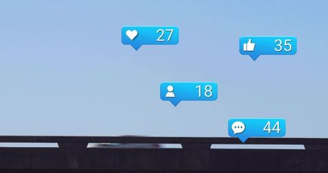 Hovering social media notification bubbles above highway overpass with blurred car motion