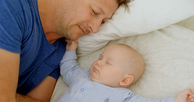 Close Up of Father and Baby Sleeping Peacefully in Bed - Download Free Stock Images Pikwizard.com