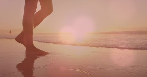 Woman Walking on Beach at Sunset Reflection in Water - Download Free Stock Images Pikwizard.com