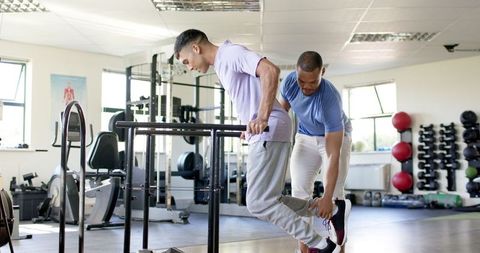 Rehabilitation Exercise with Physiotherapist Assistance in Gym - Download Free Stock Images Pikwizard.com