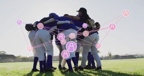 Softball team huddling with digital network overlay