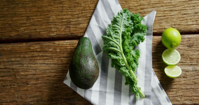 Fresh Avocado, Kale, and Lime on Rustic Wooden Surface - Download Free Stock Images Pikwizard.com