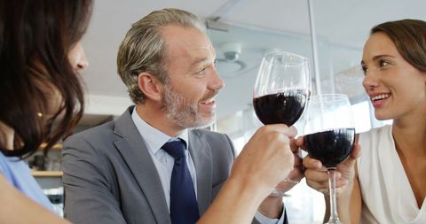 Business Colleagues Toasting Red Wine at Restaurant - Download Free Stock Images Pikwizard.com