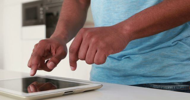 Man Engaging with Tablet in Relaxed Home Environment - Download Free Stock Images Pikwizard.com