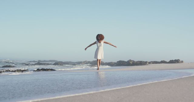 Woman Enjoying a Peaceful Moment on a Beach - Download Free Stock Images Pikwizard.com