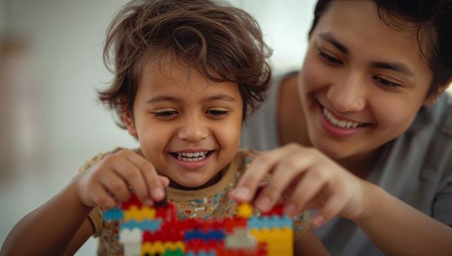 Mother and child building with blocks in playroom