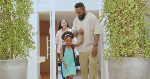 Family Preparing Daughter for School Day with Joy