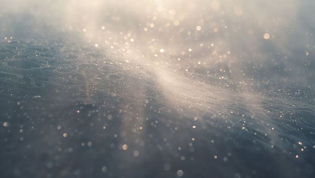 Shimmering Water Droplets Reflecting Morning Sunlight