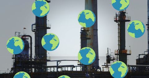 Global Earth Emblems Over Industrial Refinery Silhouette