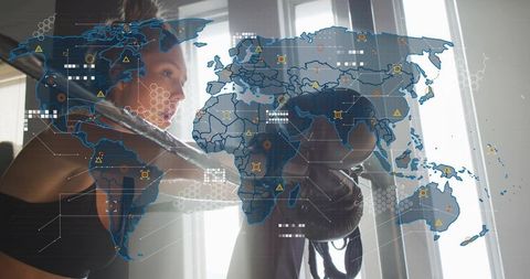 Female boxer training with holographic world map overlay for global performance tech