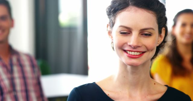 Smiling Woman Participating in Group Meeting - Download Free Stock Images Pikwizard.com