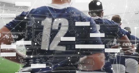 Team of Athletes Analyzing Digital Data on Sports Field