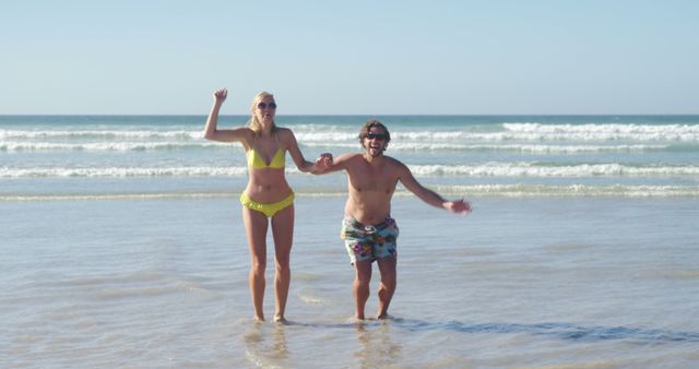 Couple Enjoying Playful Moment at Beach - Download Free Stock Images Pikwizard.com