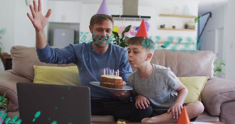 Father and son celebrating birthday virtually at home