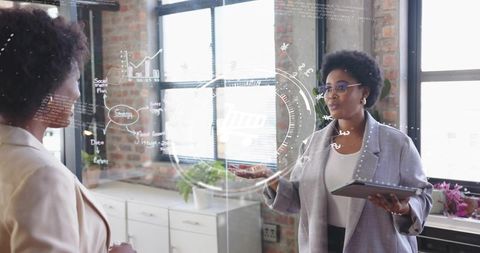 Confident Businesswomen Brainstorming in Modern Office