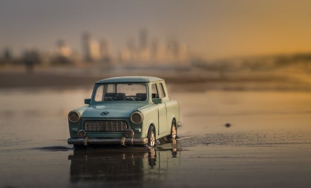 Miniature Vintage Car at Sunset on Beach - Download Free Stock Photos Pikwizard.com
