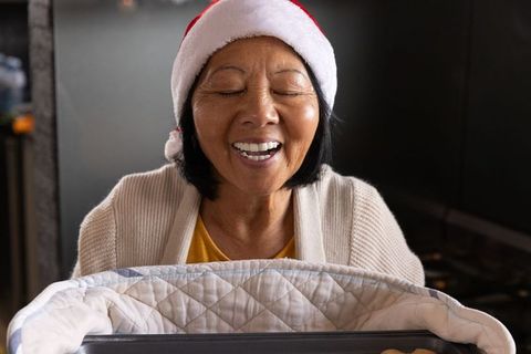 Joyful Grandmother with Santa Hat Enjoying Holiday Season