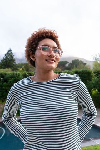Serene Outdoor Portrait of African American Woman by Poolside