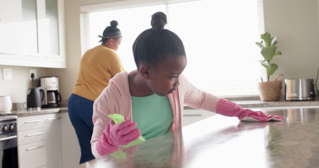 Mother and Daughter Cleaning Kitchen Together on a Bright Morning - Download Free Stock Images Pikwizard.com