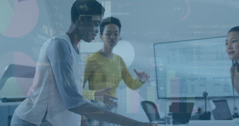 Women Analyzing Financial Data in Modern Office