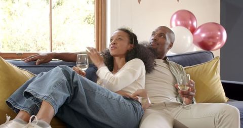 Couple Enjoying Wine Together at Home Celebration