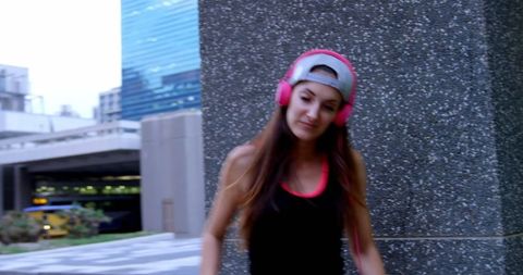 Urban Dancer with Headphones in Modern Cityscape - Download Free Stock Images Pikwizard.com