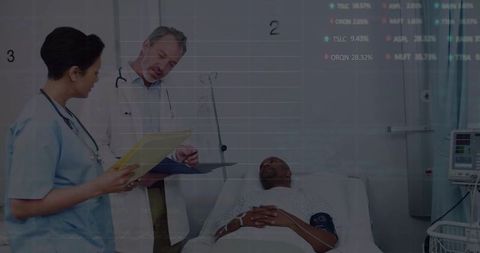 Healthcare Professionals Discussing Patient Treatment Plan in Hospital Room