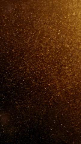 Drifting amber particles in vertical loop with warm golden bokeh and cinematic glow