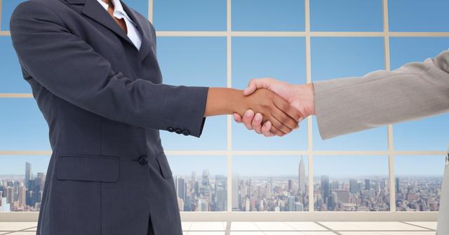 Business professionals are handshaking in a modern office with a cityscape in the background. Perfect for depicting successful partnerships, business deals, and professional collaborations.