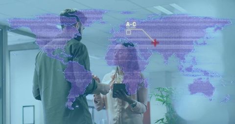 Colleagues Discussing Global Data Projection on Glass Wall While Holding Tablet in Office