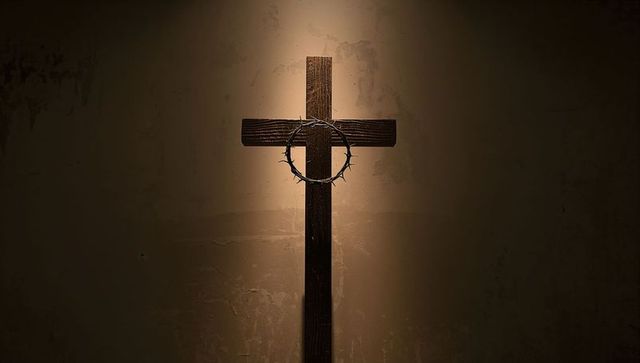 Illuminated Wooden Cross with Crown of Thorns in Chapel