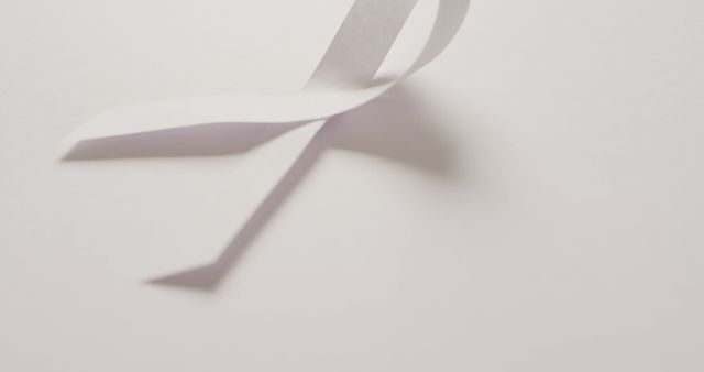 Image of white lung cancer ribbon on white background. medical and healthcare awareness support campaign symbol for lung cancer.
