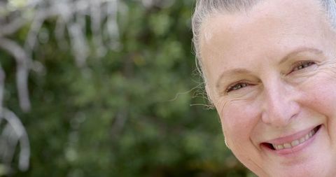 Senior Woman with Confident Smile and Healthy Lifestyle Outdoors