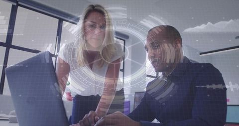 Business Professionals Collaborating with Futuristic Digital Display