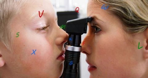 Pediatric clinician performing eye exam with retinoscope, closeup patient interaction