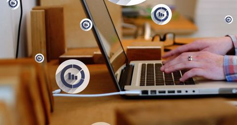 Businessman Analyzing Data on Laptop with Graphical Overlays