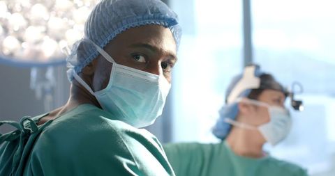 Professional Surgeons Performing Complex Surgery in Operating Room