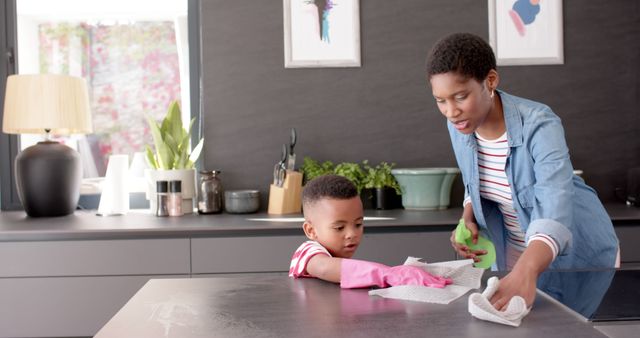 Mother and Son Cleaning Kitchen Together for Chores and Bonding - Download Free Stock Images Pikwizard.com