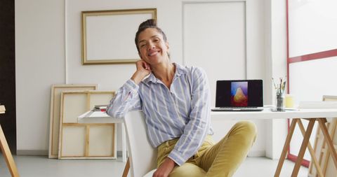 Happy Female Designer in Studio Smiling Confidently - Download Free Stock Images Pikwizard.com