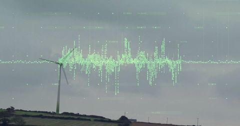 Wind turbine in rural landscape with data overlay