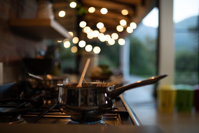 Cooking Spaghetti in Modern Kitchen with Bokeh Lights - Download Free Stock Images Pikwizard.com