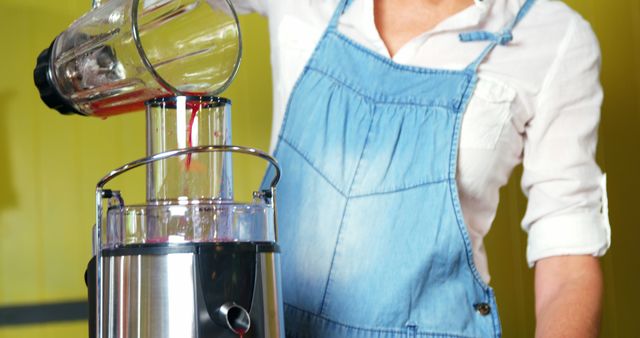 Person Using Juicer in Kitchen with Fresh Fruits - Download Free Stock Images Pikwizard.com