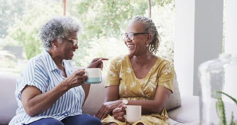 Joyful Senior Women Enjoying Coffee and Conversation